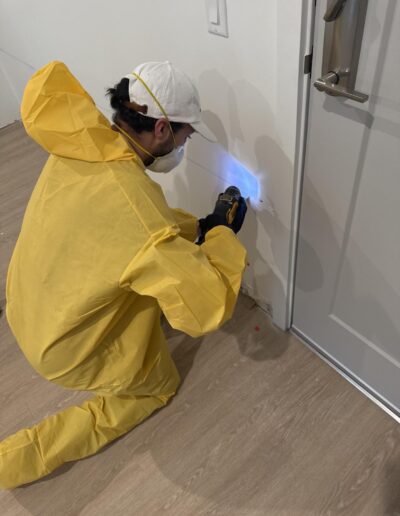 Total Restoration service worker repairing water damage